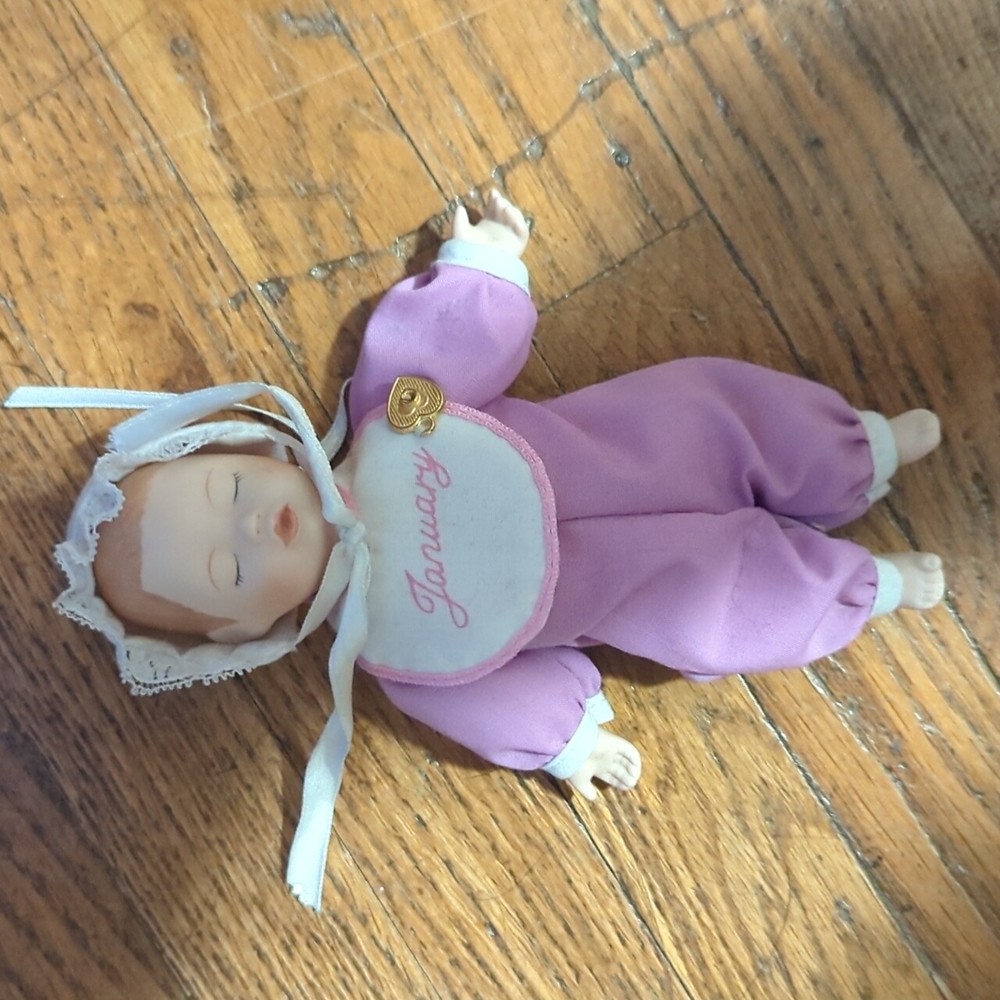 Porcelain miniature baby doll